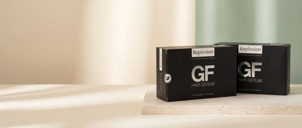 Deux coffrets de Sérum GrowthFactor sur une plaque de travertin